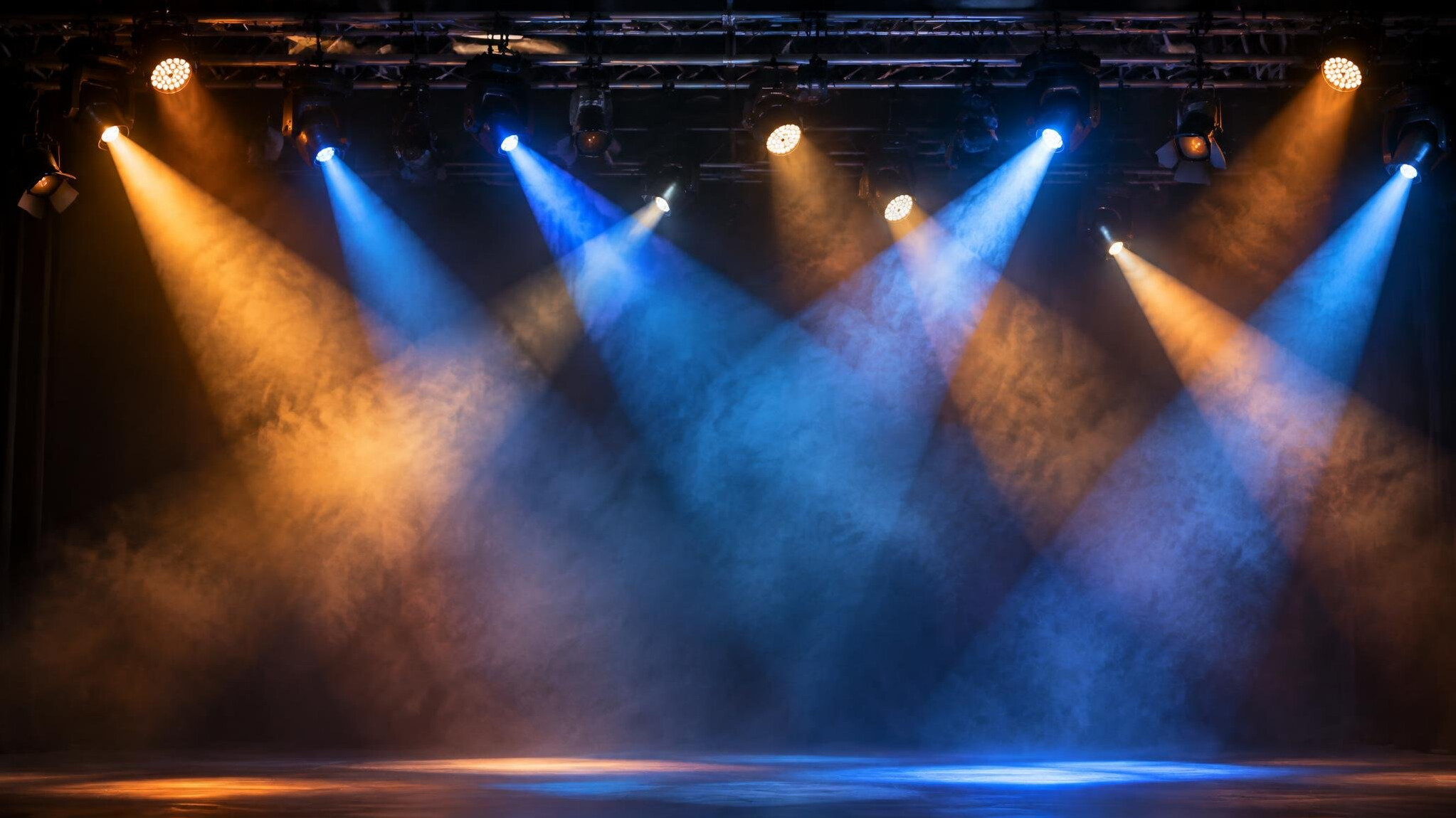 Stage lighting rig with spotlights and colored beams